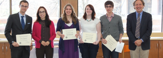 Photo of students receiving awards with faculty. 
