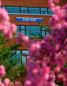 Park Hall framed by Spring Cheery Blossoms. 