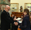 Erin McDonald receives the Opler Scholarship for Dissertation Writing from Donald Pollock.