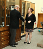 Heather Rosch receives congratulations on her master's conferral from Donald Pollock.