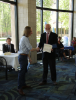 Mark Conaway, left, accepts the award certificate for his first place finish in the annual student poster competition. 
