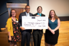 From left, Maggie Saia, safety director at Oneida Sales and Service; Ezra Staley, executive director of social innovation at UB; and Aric Gaughan and Alyssa Bergsten, UB Social Impact Fellows, celebrate the fellows’ win for their construction worker safety program.