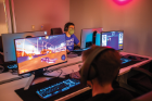 Students hone their skills in UB’s new lounge for “esports,” or competitive gaming, in Hadley Village. The space allows gamers to develop teamwork and sharpen their strategy. It also supports UB’s varsity teams in the Esports Collegiate Conference, representing 12 universities. PHOTO BY DOUGLAS LEVERE