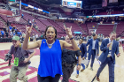 It's "horns up" for Coach Felisha Legette-Jack as she leaves the court after her team's 102-79 victory over the South Florida Bulls.