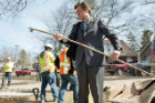 Edwards examines a length of pipe that supplied the home of Flint resident Elnora Carthan.