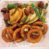 NY Deli & Diner’s pierogis and kielbasa with peppers and onion rings.