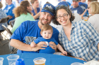 Steve Morris and Ruth Kleinman (BA ’05) of New York, N.Y., enjoyed the tent party with their little boy in blue.