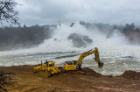 Heavy equipment operators dig access points to the riverbank to allow heavy equipment access to remove the sediment and debris from the diversion pool area just below the damaged spillway at Oroville Dam in Butte County. Photo taken February 17, 2017. Brian Baer/ California Department of Water Resources