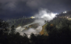 A night view of the damaged Oroville Dam spillway as the California Department of Water Resources increased the outflow form the Oroville Dam spillway from 55,000 cubic feet per second (cfs) to 60,000 (cfs), in anticipation of the expected increase of inflows into Lake Oroville from the latest round of winter storms. Photo taken February 20, 2017. Zack Cunningham / California Department of Water Resources