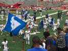 UB Bulls football players, cheerleaders and fans celebrating a win against Rutgers. 
