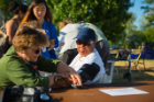 From Left Holly Johnson with Accessibility Resources, getting a blood test from UB on the Green in Front of Hayes Hall on the South Campus Photographer: Douglas Levere