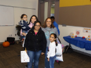 Alumna and her family share time together at a Strengthening Families Celebration