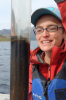 Elizabeth Thomas, UB assistant professor of geology, inspects a lake sediment core, which contains mud from the bottom of a Greenland lake. Such samples can be analyzed for clues about the history of precipitation in a region. Credit: Anna McKee