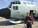 UB Assistant Professor of Geology Elizabeth Thomas gets ready to board a plane to Greenland. She and fellow scientists — along with artist Anna McKee — hitched a ride with the 109th Airlift Wing of the New York Air National Guard.