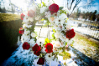 wreath of roses at gravesite. 