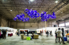 Architecture faculty member Virginia Melnyk participated in the fair with a site-specific installation. "Purple," which won a People's Choice award, emerges from the ceiling as geometric, star-like clusters, seeming to be expanding, growing and shifting. Photo: Mahan Mehrvarz