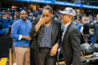 Women's coach Felisha Legette-Jack, who appears to be overcome with emotion after the win, is congratulated by President Satish K. Tripathi. Photo: Paul Hokanson