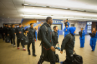 The UB men's basketball team leaves Alumni Arena en route for Thursday's NCAA Tournament first-round tilt with the University of Miami in Providence, Rhode Island. Photo: Douglas Levere