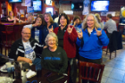 Taking in the UB women's game at Santora's on Millersport Highway are, clockwise from front center: Judy Smith, Mike Smith, Patti Kindron, Val Wudyka, Mary Meyer and Marian Iak. Photo: Douglas Levere