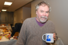 George DeTitta, UB professor of structural biology and research scientist at Hauptman-Woodward Medical Research Institute, shows off his Coppens mug.
