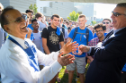 President Satish K. Tripathi (left) and Scott Weber, vice president for student life, share a joke with students at Opening Weekend in August.