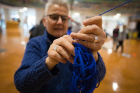 Renee Ruffino untangles her yarn.
