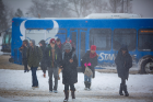 Students bundle up as they leave a cozy Stampede bus for a trek across the frozen campus.