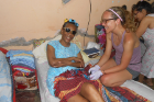 Family medicine resident Brianne MacKenzie enjoys a chat with a woman at the Asilo nursing home in Bocas del Toro.