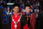 UB President Satish K. Tripathi enters Alumni Arena at the beginning of the morning commencement ceremony.
