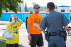 A police officer talks with "parents" of a victim.