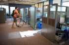 Cory Nealon places his bicycle in its storage spot in 330 Crofts Hall. 