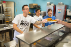 From left: Christopher Keough, Carmella Marinaccio and Jomarie Woltz serve meals at the City Mission. Photo: Douglas Levere