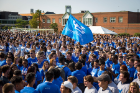 Later, after meeting with their orientation groups, new students gathered on the Special Events Field to form the human interlocking UB. Photo: Meredith Forrest Kulwicki