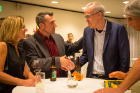 Author and environmentalist Bill McKibben (right) greets Humanities Institute Director David Castillo at a reception before his keynote address of the Buffalo Humanities Festival Friday at the Albright-Knox Art Gallery. Photo: Meredith Forrest Kulwicki