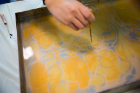 Ebru uses natural gums, paints and tools to create designs on water that are then transferred to paper.