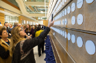 Donors took the opportunity to photograph their names on the wall honoring the Circle of Leaders, which includes 207 members.
