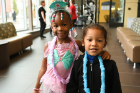 Anari Stokes, age 4 (pink princess), and Javion Osorto (in blue lei), age 3, are ready for the party.