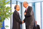 President Tripathi and Jeremy M. Jacobs share a heartfelt handshake. Photo: Douglas Levere
