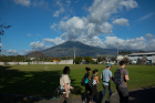 The Miravalles volcano looms in the distance as the students walk to the geothermal plant where the electricity for the entire country is managed.