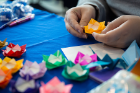 Students make some origami roses as part of Love and Support Day.