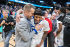 Coach Nate Oats congratulates senior guard Wes Clark, who led the Bulls with 26 points, five rebounds, three assists and four steals. Clark was named the MAC Tournament's Most Valuable Player.