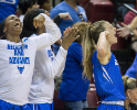 UB guard Stephanie Reid (right) and teammates react to a shot in the second half.