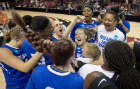 UB guard Stephanie Reid (center) and the rest of the team celebrate their upset of Florida State, 86-65, on Florida State's home court.