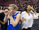 UB guard Katherine Ups and coach Felisha Legette-Jack both wipe their eyes at mid-court after celebrating their win over Florida State.
