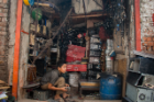 A boy working inside an e-waste recycling shop. Child labor is very prevalent in this industry, Aich says.