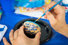 Participants painting rocks were encouraged to share their artwork on Facebook.