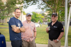 From left: UB staff members Dan Kelly, Domenic Licata and Hugh Jarvis chat during the Professional Staff Senate's Summer BBQ, which was held during the UB on the Green event.
