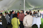 Attendees gather under the tent for the closing reception. Photo: Nancy J. Parisi