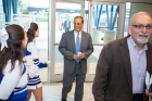 President Satish K. Tripathi is greeted by cheerleaders as he enters the Gicewicz Club. At right is Joseph Gardella, SUNY Distinguished Professor and John and Frances Larkin Professor of Chemistry.
