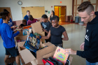 Buffalo area students peruse the supplies collected.